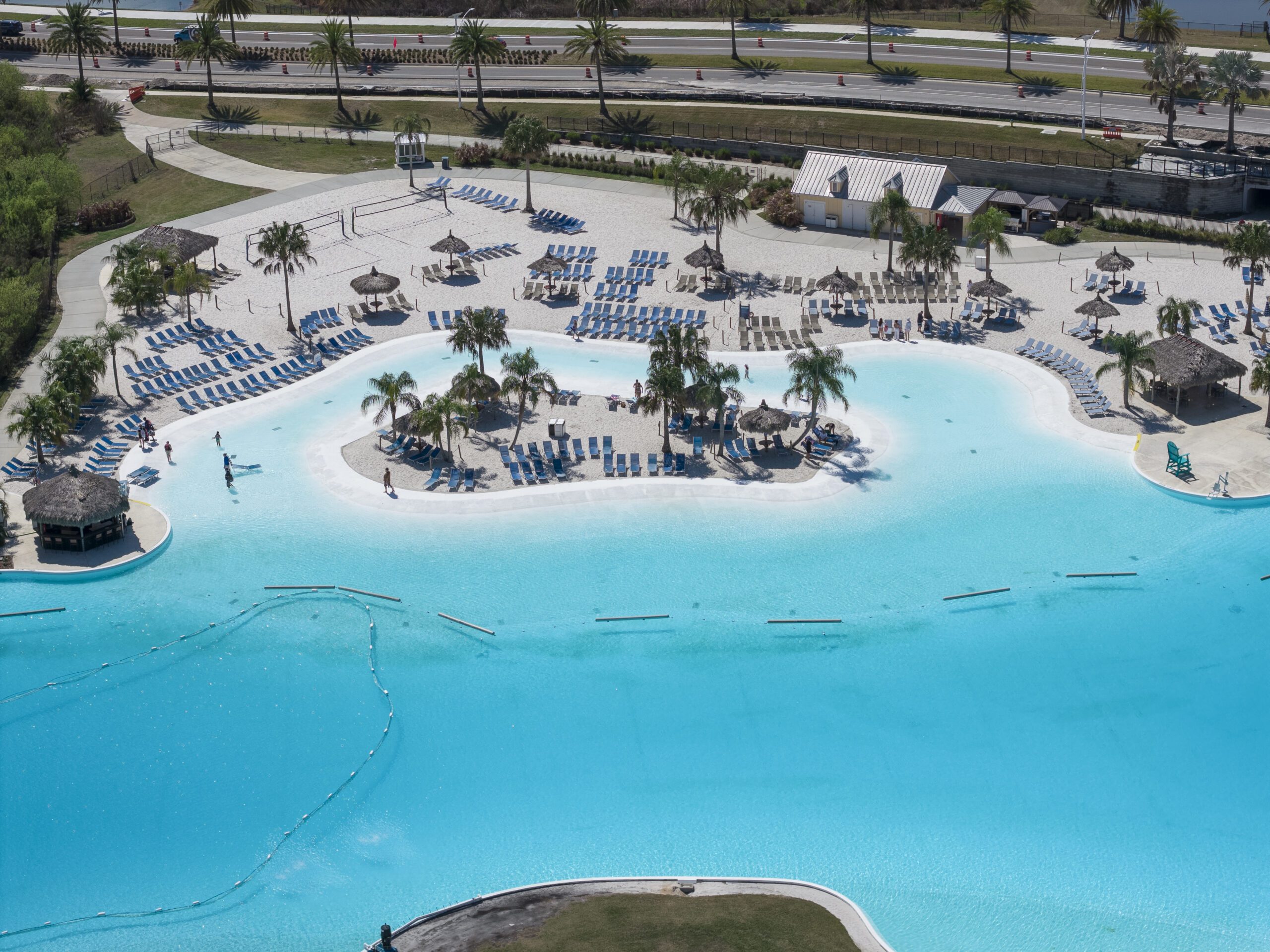 Epperson Tropical lagoon with lounge chairs and palms