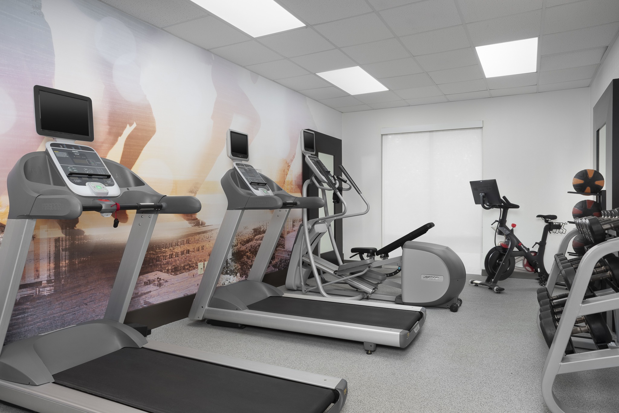 Modern hotel fitness room with exercise equipment