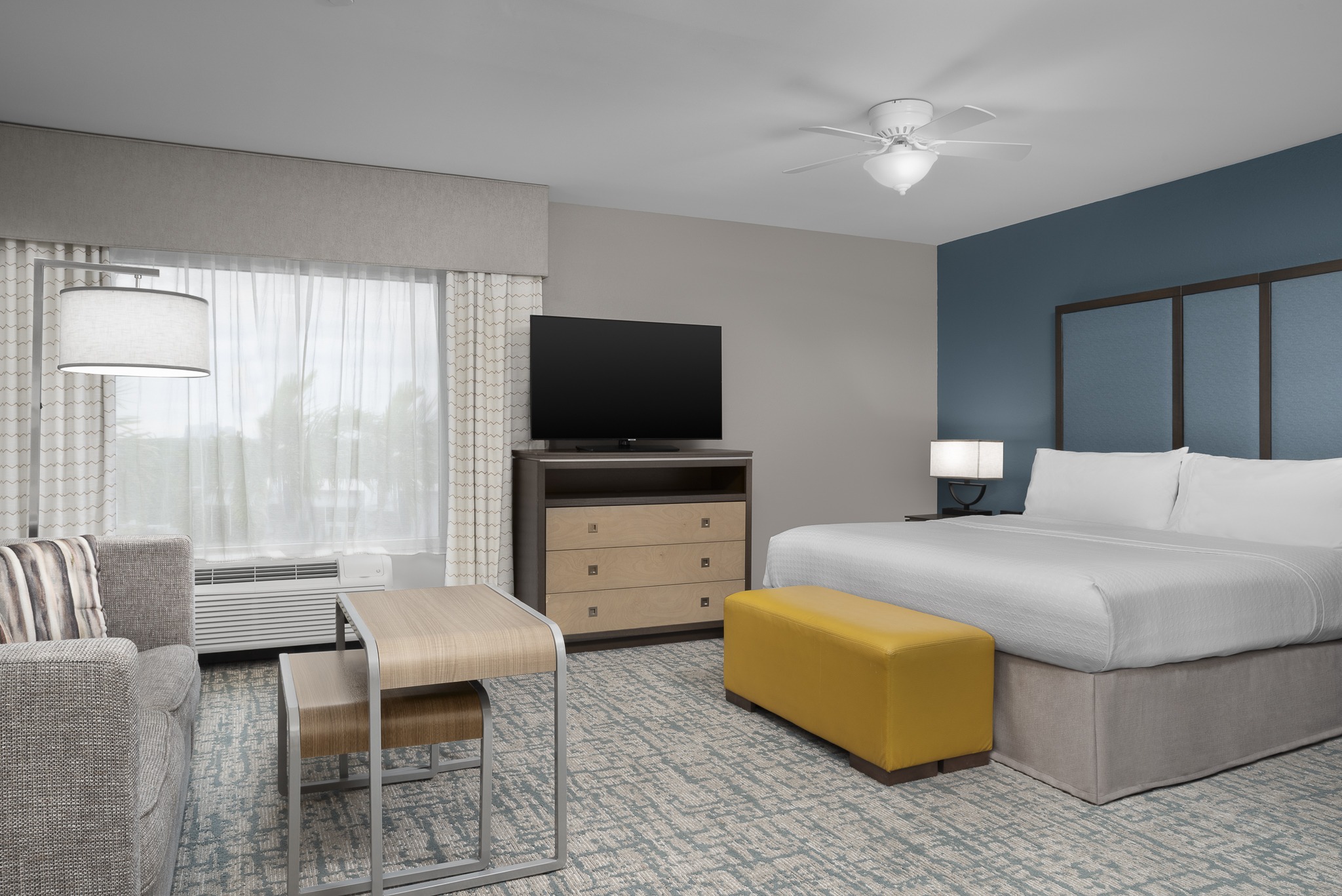 Modern hotel room with comfortable furnishings