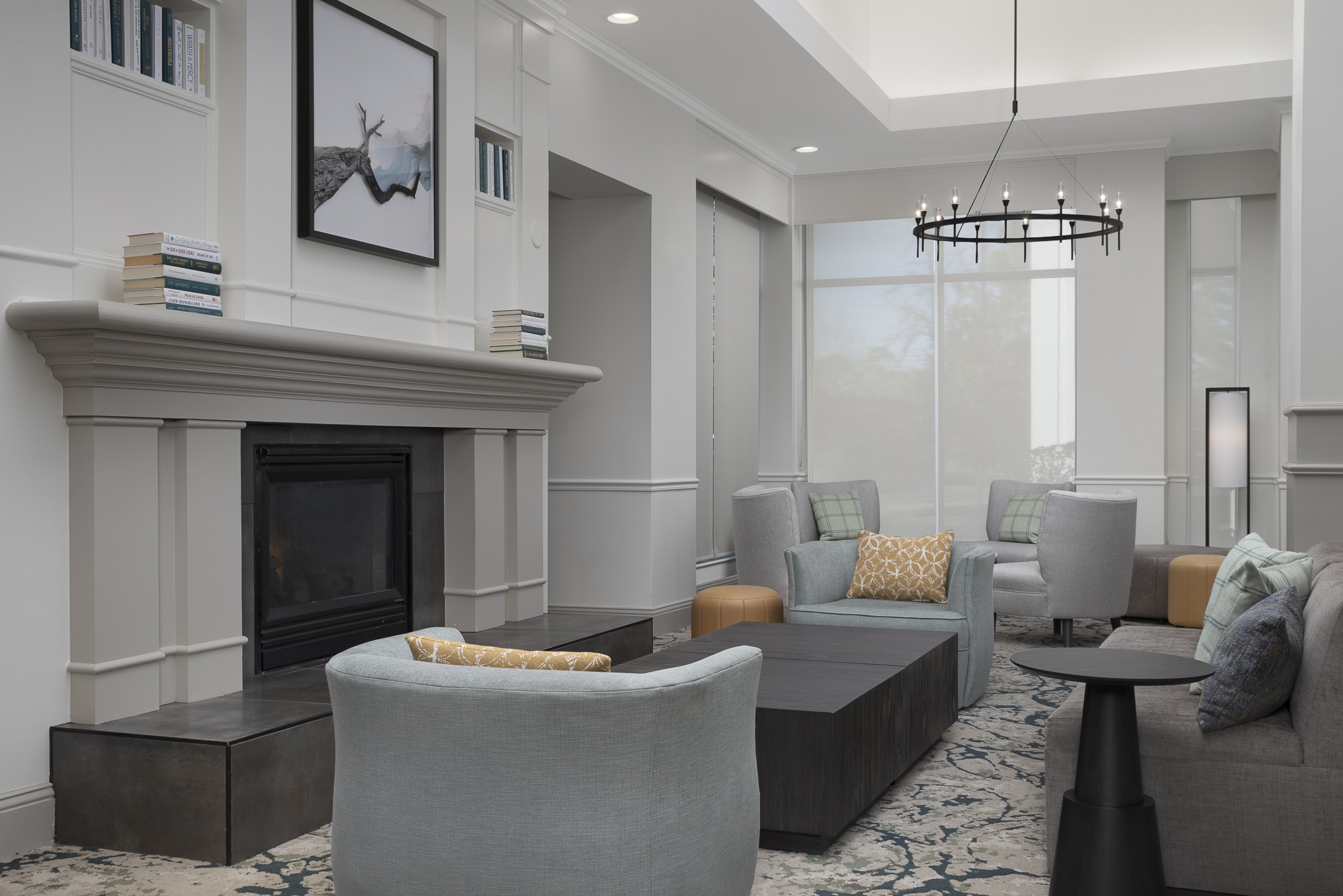 Modern hotel lobby with fireplace and seating